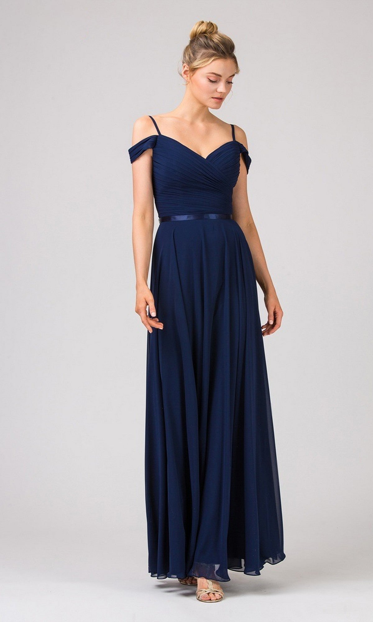 Model wearing the Eureka 7611 long prom dress in navy, featuring an off-the-shoulder ruched chiffon bodice with thin straps, posed against a plain light background.